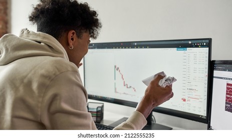 African American Trader Crumples Paper And Yelling Watching Stocks Graph. Cryptocurrency And Decentralized Finance Concept. Showing Sad Expressions. Economy Or Stock Market Going Down.