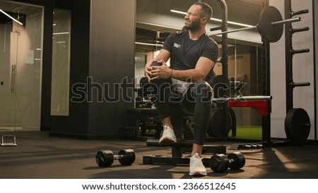 African American unwell man sad suffering with knee pain in sport club workout trauma sporty man muscle ache sportsman athlete male injuring leg in training painful injury in fitness gym ache damage