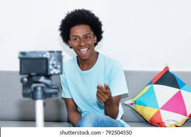 African American Vlogger Recording Video Blog At Home