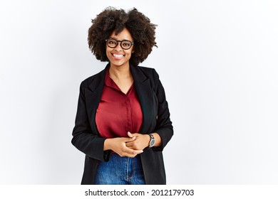 African american woman with afro hair wearing business jacket and glasses with hands together and crossed fingers smiling relaxed and cheerful. success and optimistic  - Powered by Shutterstock