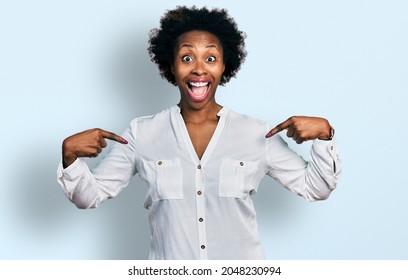 African American Woman With Afro Hair Pointing With Fingers To Herself Celebrating Crazy And Amazed For Success With Open Eyes Screaming Excited. 