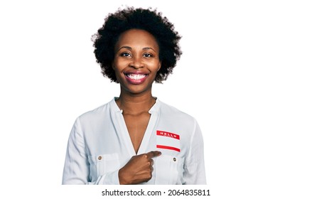 African American Woman With Afro Hair Wearing Hello My Name Is Sticker Identification Smiling With A Happy And Cool Smile On Face. Showing Teeth. 