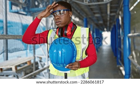 African american woman architect take out hardhat for hot at street