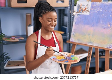 African american woman artist smiling confident drawing at art studio - Powered by Shutterstock