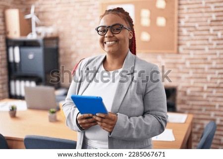 African american woman business worker using smartphone at office