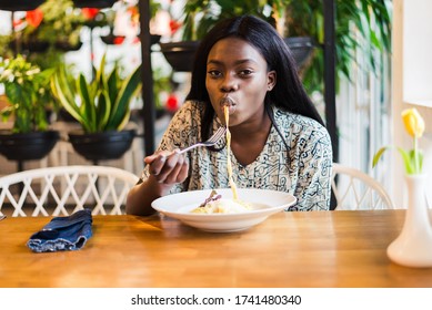 African American Woman In Cafe Eat Spaghetti Pasta