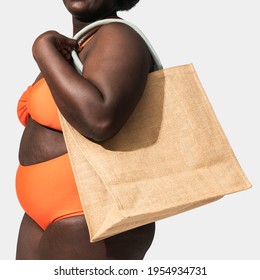 African American Woman Carrying A Tote Bag, Ready For The Beach