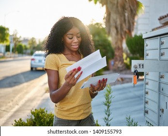 african american woman checking mail in las vegas community