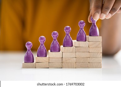 African American Woman Climbing Stairs In Office - Powered by Shutterstock