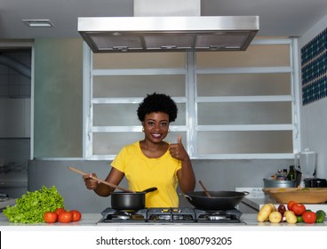 African american woman cooking at kitchen at home