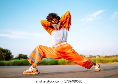 African American woman - dancer dancing in the street at sunset. Sport, dancing and urban culture concept. Fashion lifestyle. - Powered by Shutterstock