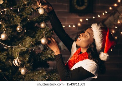 African American Woman Decorating Christmas Tree