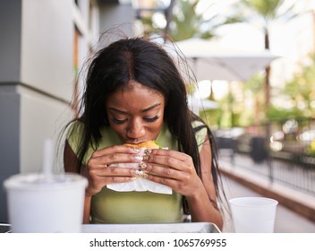 African American Woman Eating Chicken Sandwich