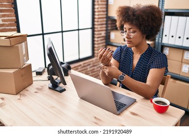 African American Woman Ecommerce Business Worker Suffering For Hand Injury At Office