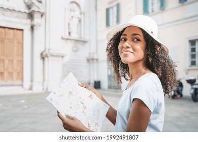 African American Woman Exploring City On Summer Holidays