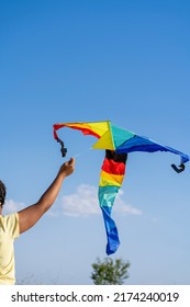 African American Woman Flying A Colorful Kite 
