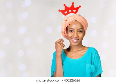 African american woman having fun with photo props - Powered by Shutterstock