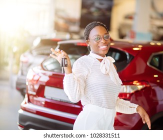 African American Woman With Her New Car Showing Key