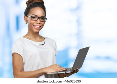 African American Woman Holding Laptop