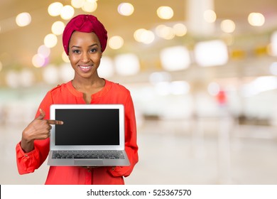 African American Woman Holding Laptop