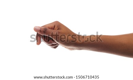 African american woman holding something in fist, ready to share, isolated on white background. Panorana with copy space