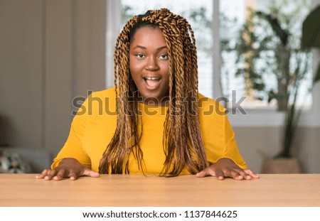 African american woman at home scared in shock with a surprise face, afraid and excited with fear expression