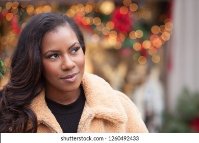 African American Woman Looking Away During Christmas Winter