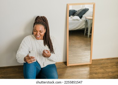 African american woman making video call in bedroom - social networks and connection - Shutterstock ID 2255851547