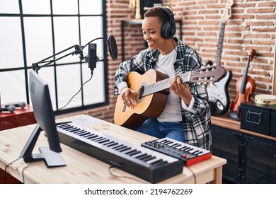 African American Woman Musician Playing Classical Guitar At Music Studio