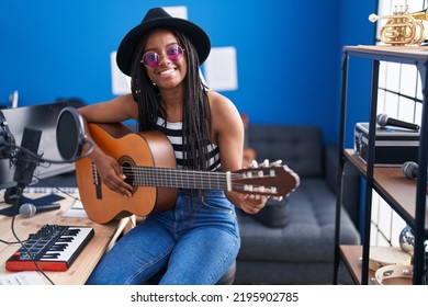 African American Woman Musician Playing Classical Guitar At Music Studio