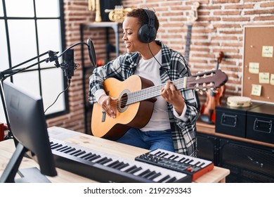 African American Woman Musician Playing Classical Guitar At Music Studio