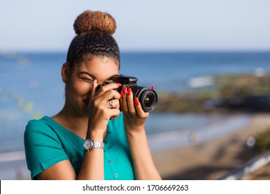 African American Woman  Photographer Taking Outdoor Photos -  Black People