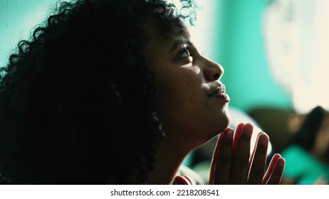 African American Woman Praying To God. A Spiritual Black Hispanic Girl In Prayer Having HOPE And FAITH