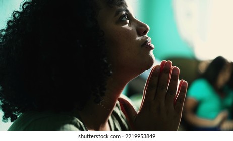 African American Woman Praying To God. A Spiritual Black Hispanic Girl In Prayer Having HOPE And FAITH