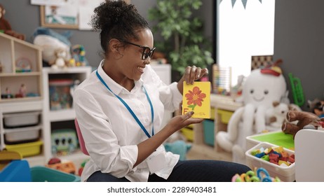 African american woman preschool teacher having vocabulary lesson at kindergarten - Shutterstock ID 2289403481