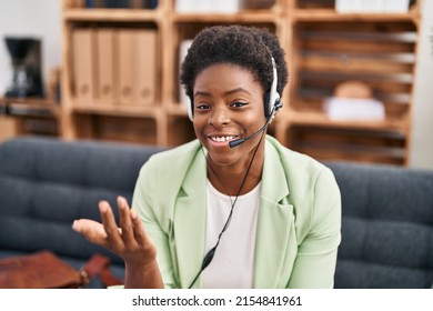 African american woman psychologist having teleconsultation sitting on sofa at psychology center