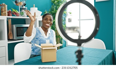 African american woman recording online tutorial for social networks at dinning room - Shutterstock ID 2311312705