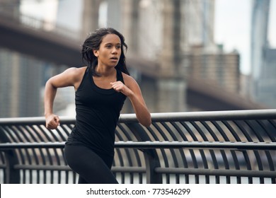 African american woman running in New York City at the morning - Powered by Shutterstock