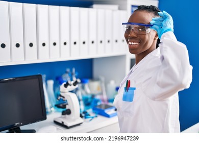 African American Woman Scientist Smiling Confident At Laboratory