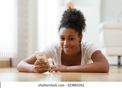 African American Woman Sending A Text Message On A Mobile Phone - Black People