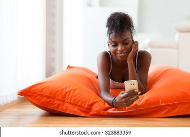 African American Woman Sending A Text Message On A Mobile Phone - Black People