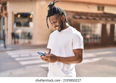 African american woman smiling confident using smartphone at street - Shutterstock ID 2195850127