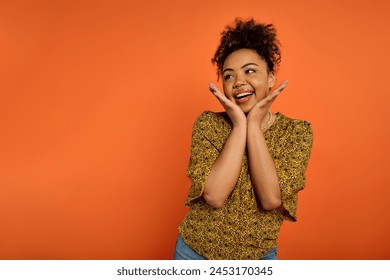 African American woman in stylish attire, hands on face, expressing deep emotion. - Powered by Shutterstock