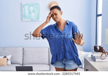African american woman suffering dizzy standing at home