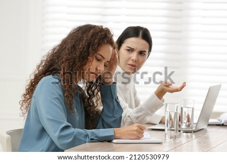 African American woman suffering from racial discrimination at work