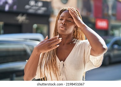 African American Woman Sweating At Street