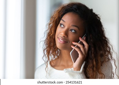 African American Woman Talking On A Mobile Phone - Black People