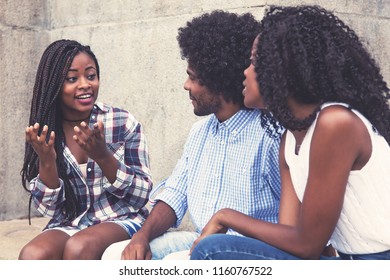 African American Woman Telling Story To Friends Outdoors In Vintage Retro Cinema Look