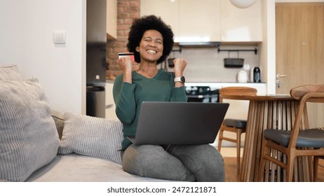 African American woman using laptop and shopping online - Powered by Shutterstock