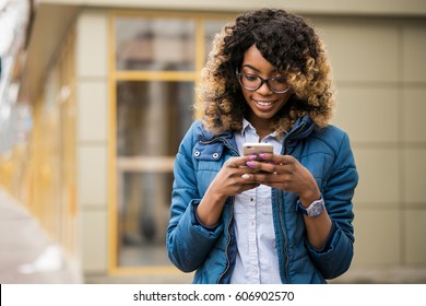 African American Woman Using Phone 